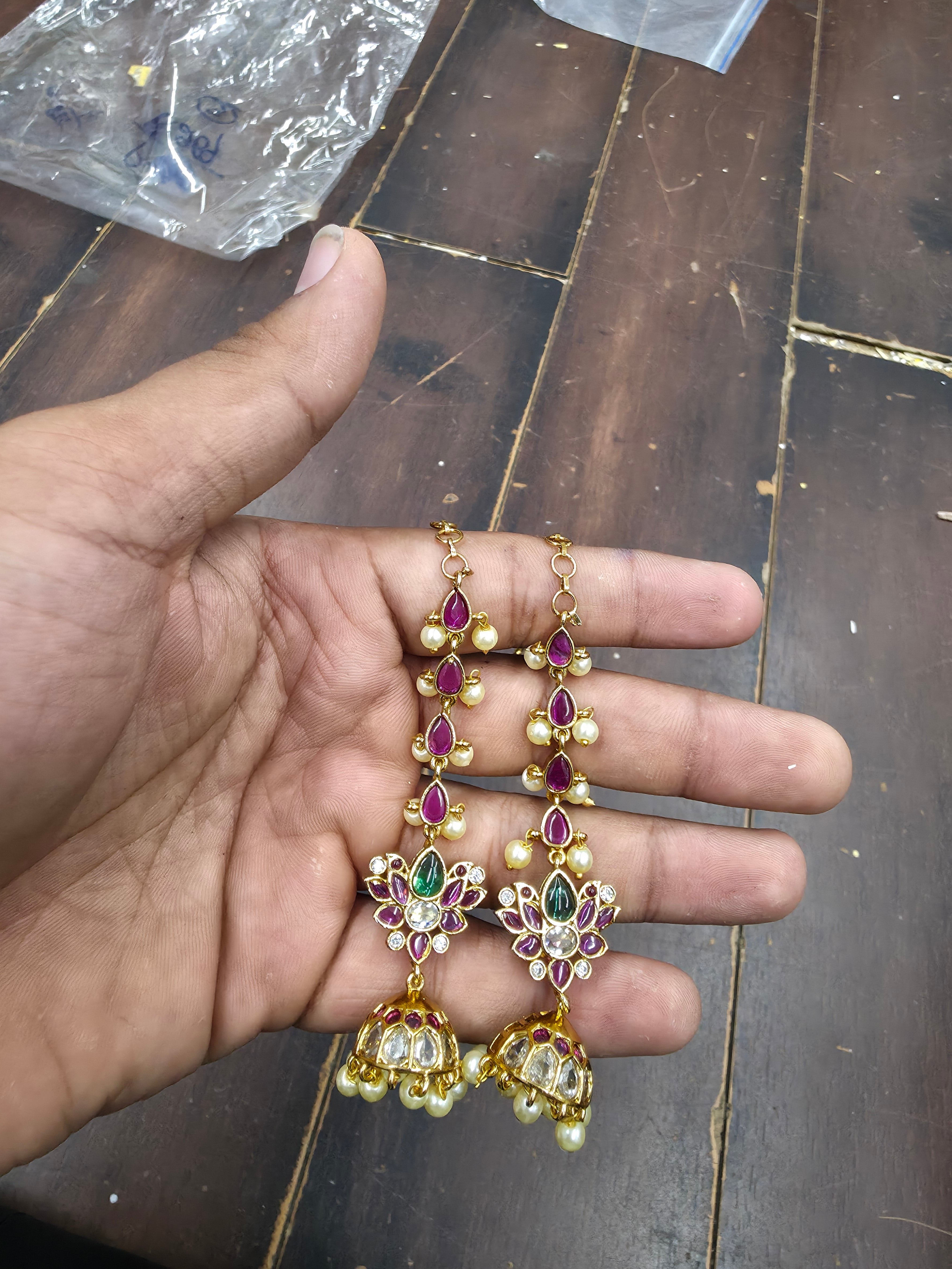 Gold-Plated Long Multi-Tiered Kemp Jhumka Earrings with Lotus Motif and Pearls