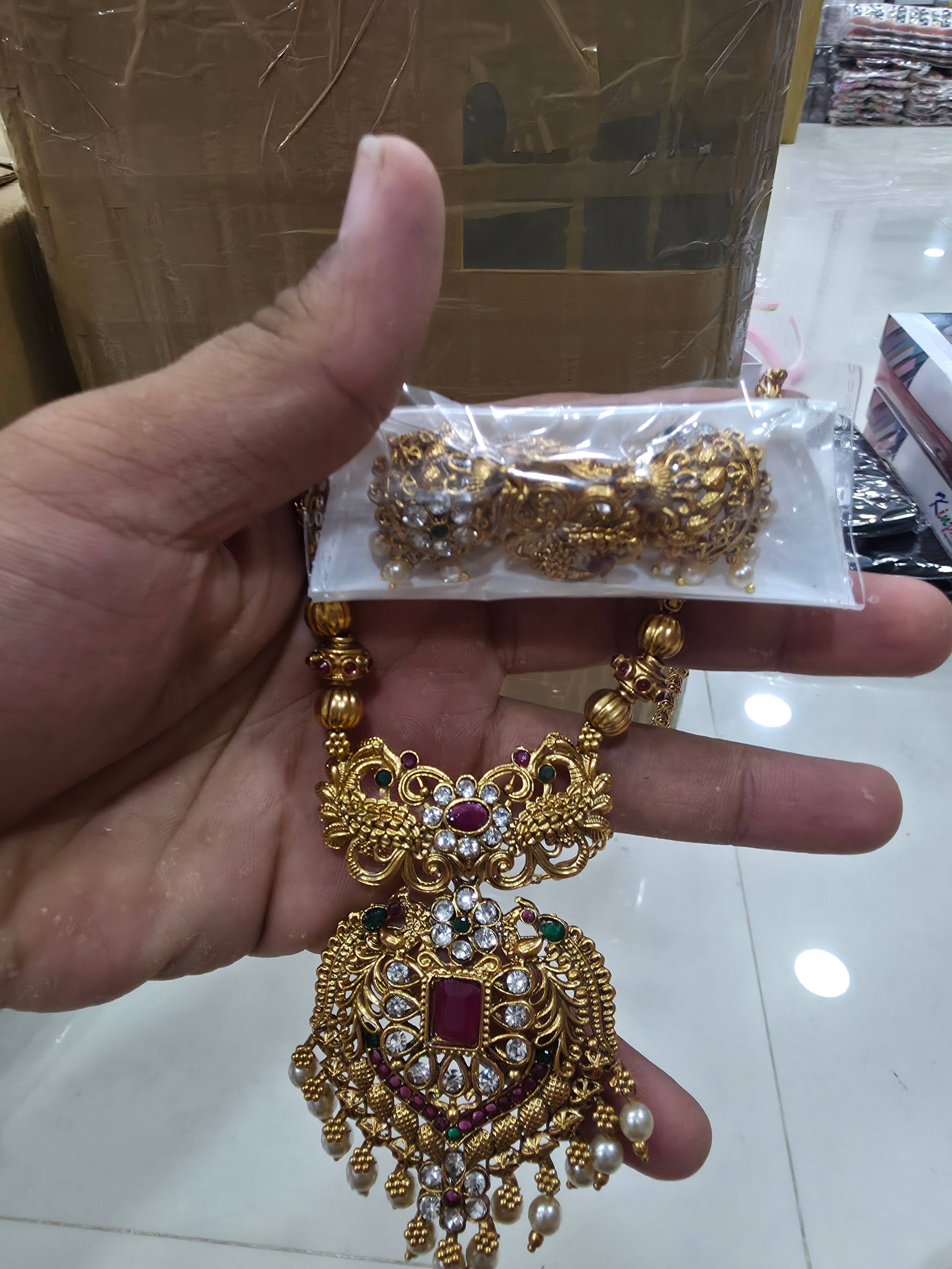 Gold-Plated Peacock Pendant Haram Set with CZ and Ruby Stones